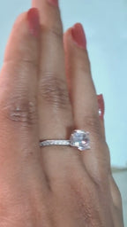 The Radiant Solitaire Diamond Ring with Elegant Pavé Band Detailing